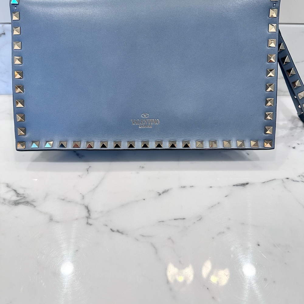 Valentino Garavani Rockstud clutch bag in light blue leather Studded